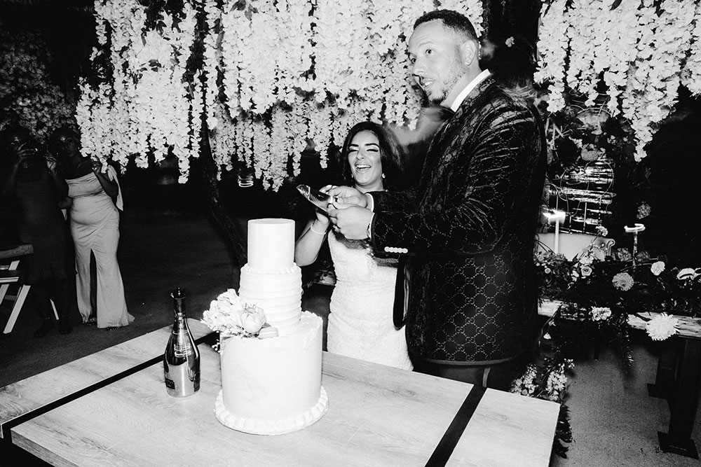 couple cuts their wedding cake 