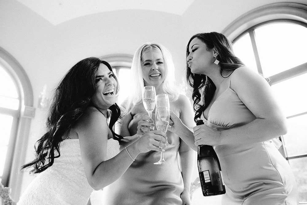 bride and bridesmaids cheers at the Catana Estate