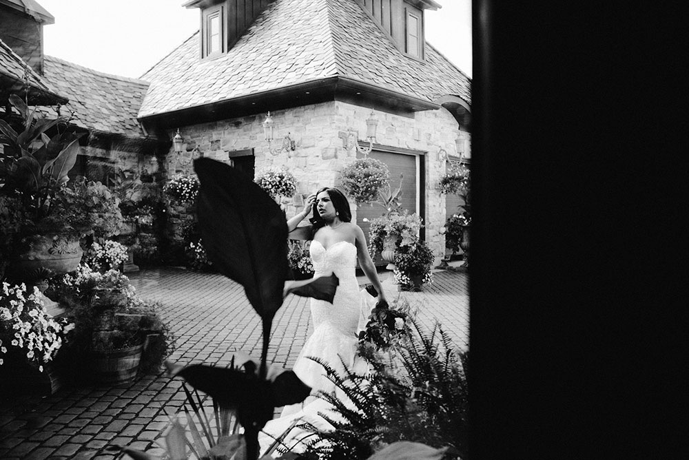 bride walks the grounds at the Catana Estate