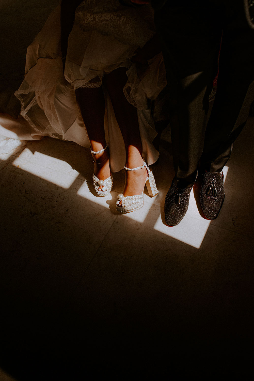 bride and groom in their designer shoes at the Catana Estate