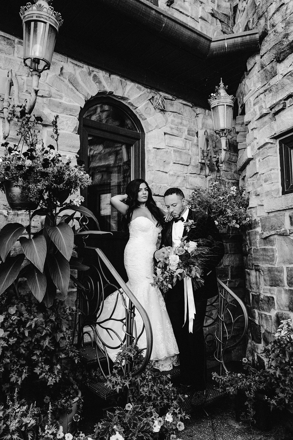 newlyweds pose for wedding portraits on the grounds of the at the Catana Estate in the summer