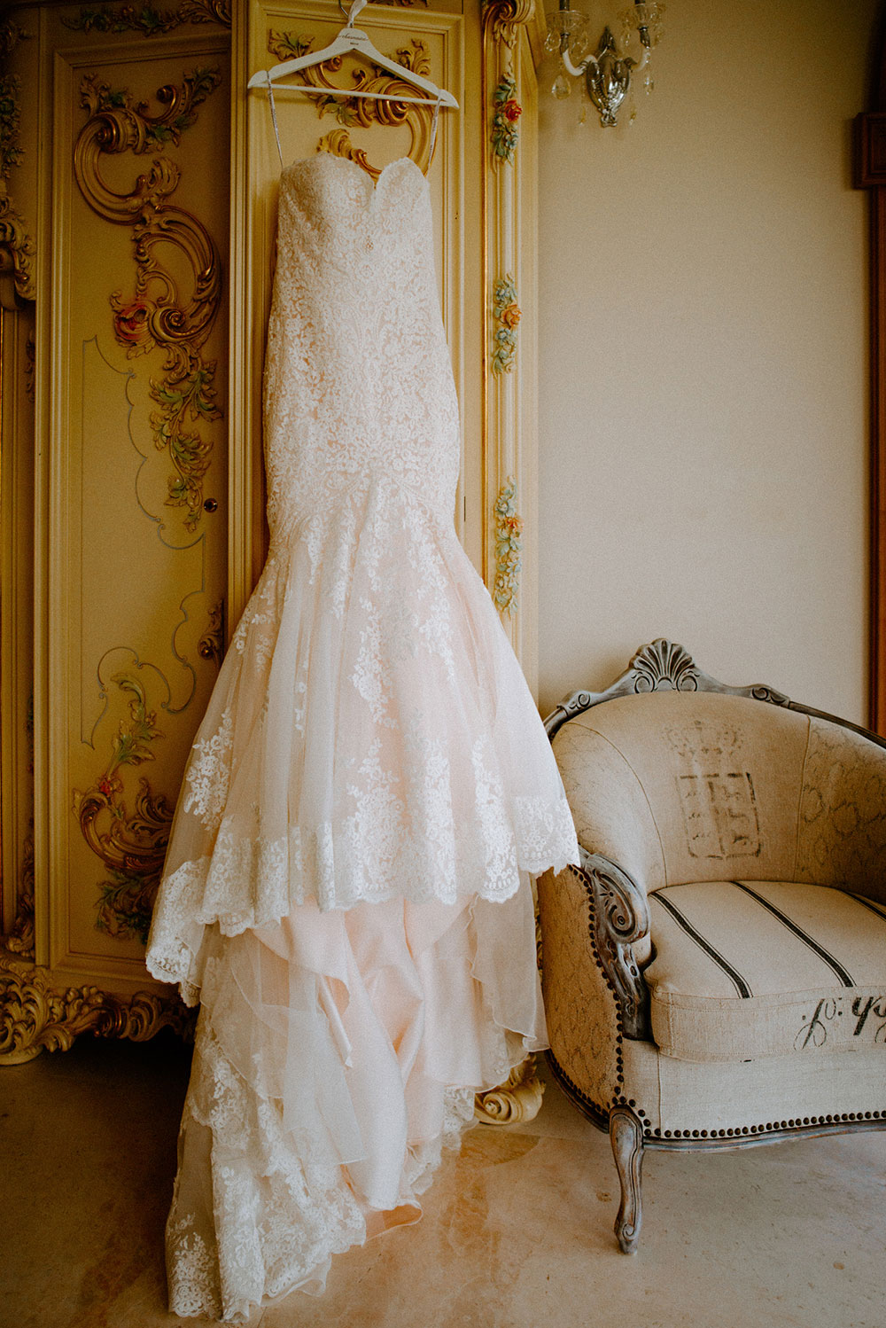 wedding gown drapped over wardrobe at the Catana Estate