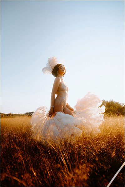 starlotte the burlesque performer in the middle of a field