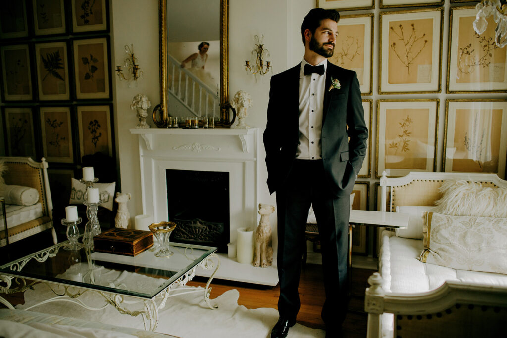 Groom stands confidently in his luxury wedding suit before his wedding ceremony in Toronto