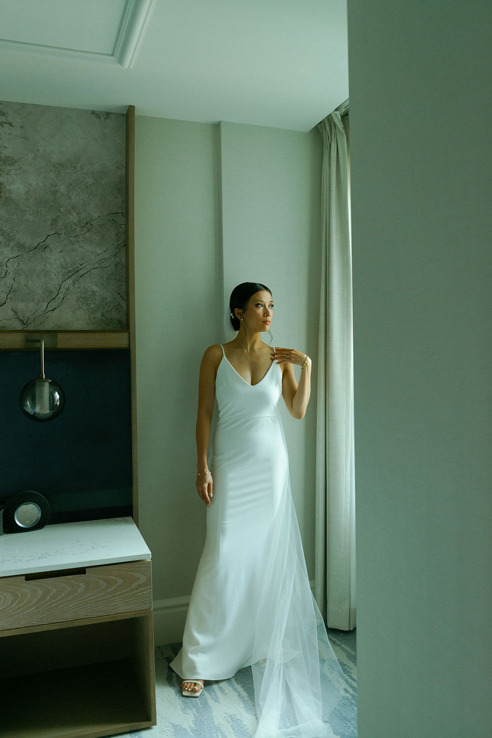 mildred's temple kitchen wedding photography of the brides posing at the st. regis hotel