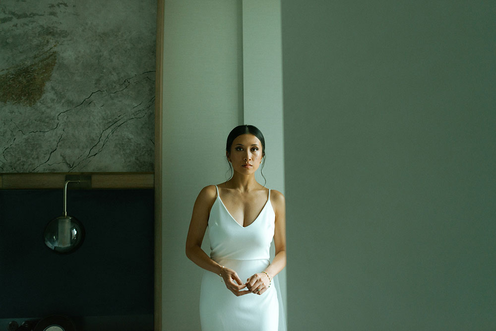 mildred's temple kitchen wedding photography of the brides posing at the st. regis hotel