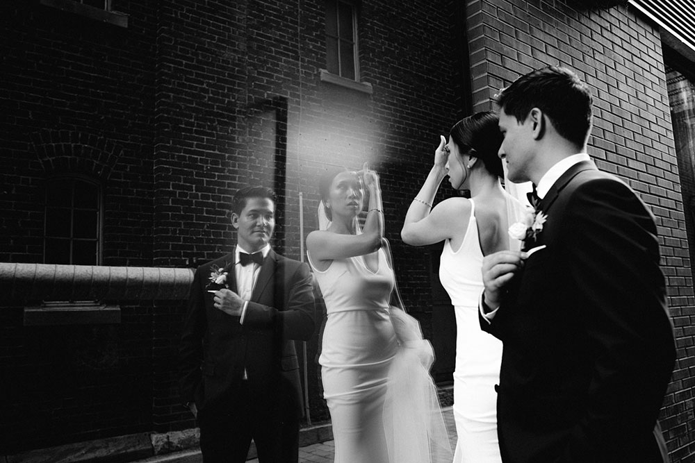 mildred's temple kitchen wedding photography of the wedding couple candidly walking around liberty village