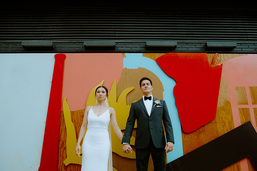 mildred's temple kitchen wedding photography of the wedding couple candidly walking around liberty village