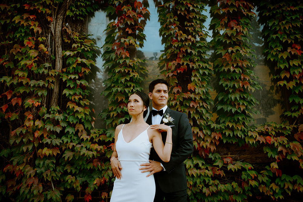 mildred's temple kitchen wedding photography of the wedding couple candidly posing around liberty village