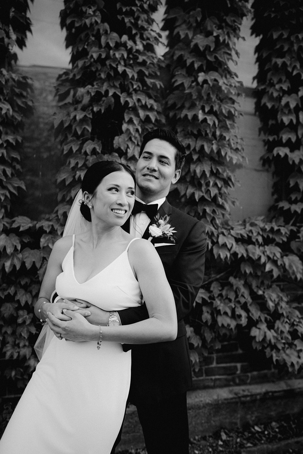 mildred's temple kitchen wedding photography of the wedding couple candidly walking around liberty village