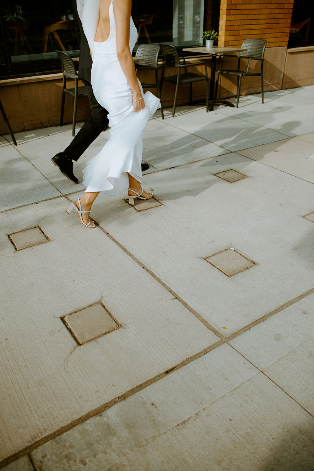 mildred's temple kitchen wedding photography of the wedding couple candidly walking around liberty village