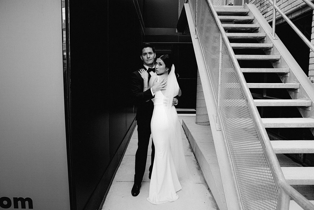 mildred's temple kitchen wedding photography of the wedding couple candidly walking around liberty village