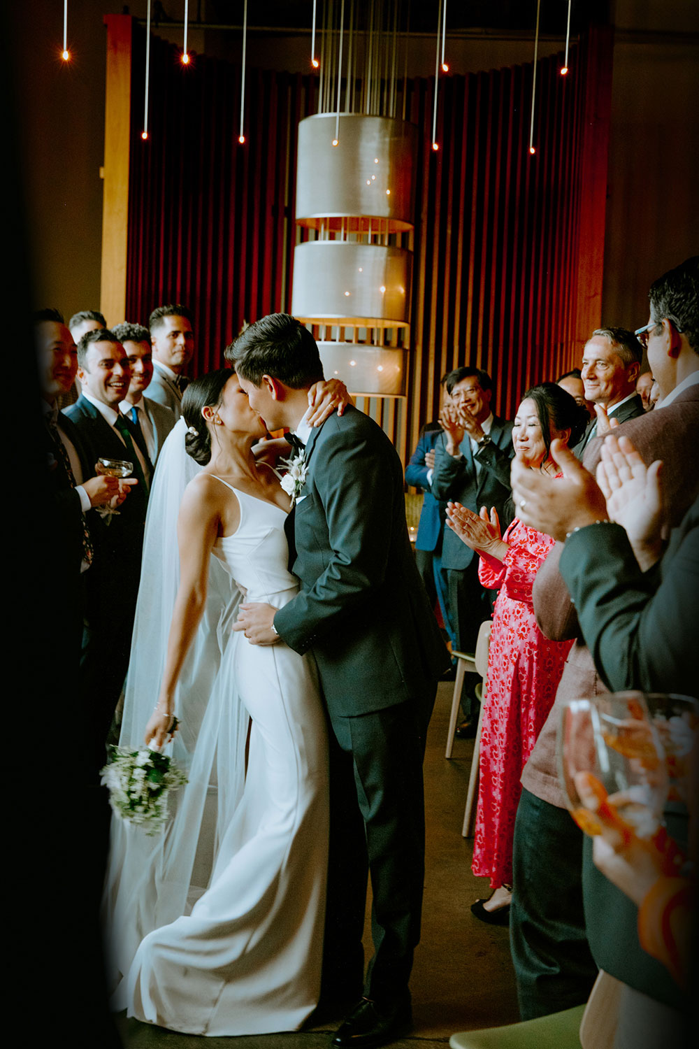 mildred's temple kitchen wedding photography of the wedding couple kissing after being pronounced husband and wife