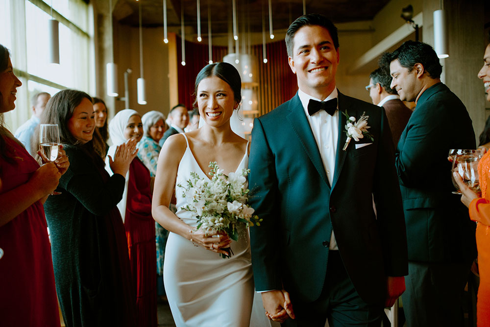 mildred's temple kitchen wedding photography of the wedding couple walking down the aisle after being pronounced husband and wife