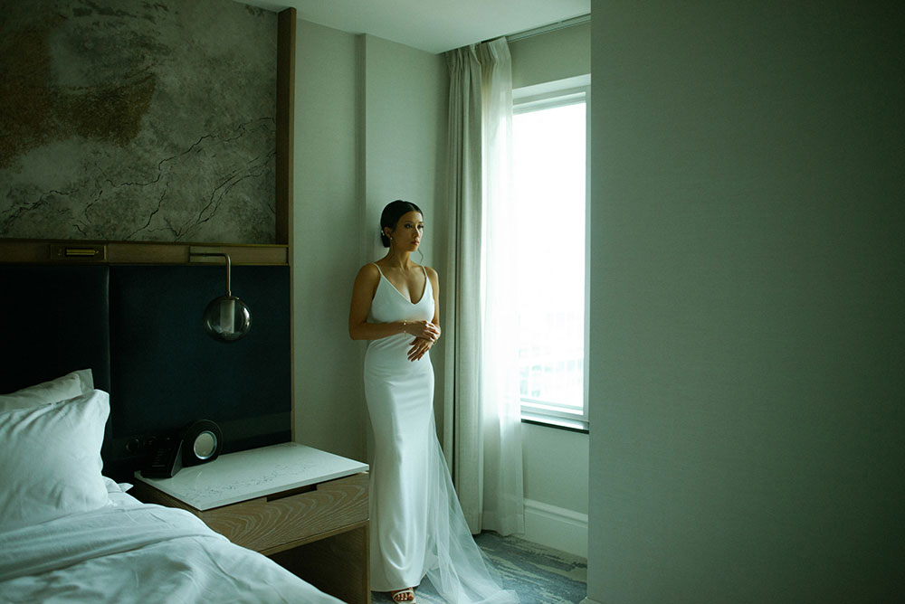 mildred's temple kitchen wedding photography of the brides posing at the st. regis hotel