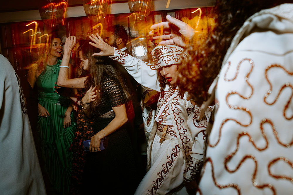 Sassafraz Yorkville Wedding Photography of the wedding party dancing on the dance floor with debke dancing