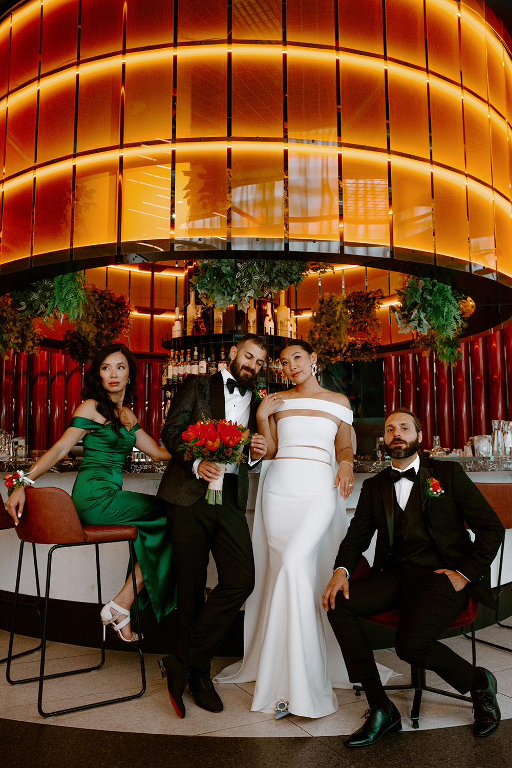 Sassafraz Yorkville Wedding Photography of the bride & groom with their wedding party posing around the lounge & bar at the W hotel 