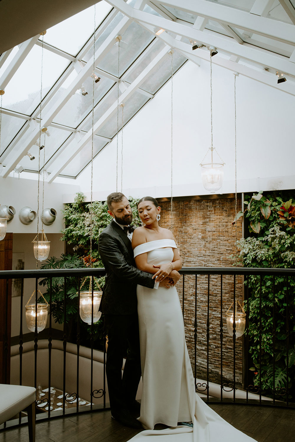 Sassafraz Yorkville Wedding Photography of the bride & groom sharing an embrace inside the wedding venue