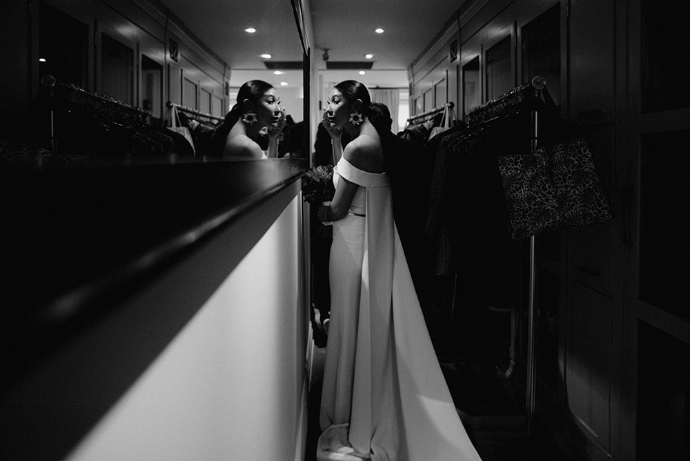 Sassafraz Yorkville Wedding Photography of the bride looking at herself in a mirror before the wedding ceremony 