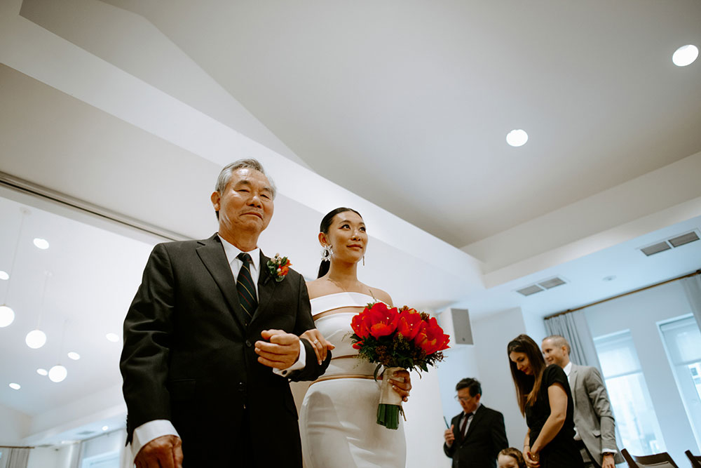 Sassafraz Yorkville Wedding Photography of the bride walking down the aisle with her father