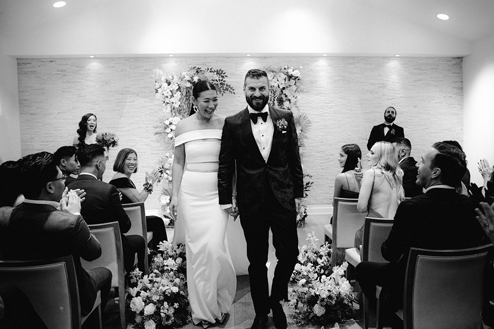 Sassafraz Yorkville Wedding Photography of the bride & groom walking down the aisle during the wedding ceremony