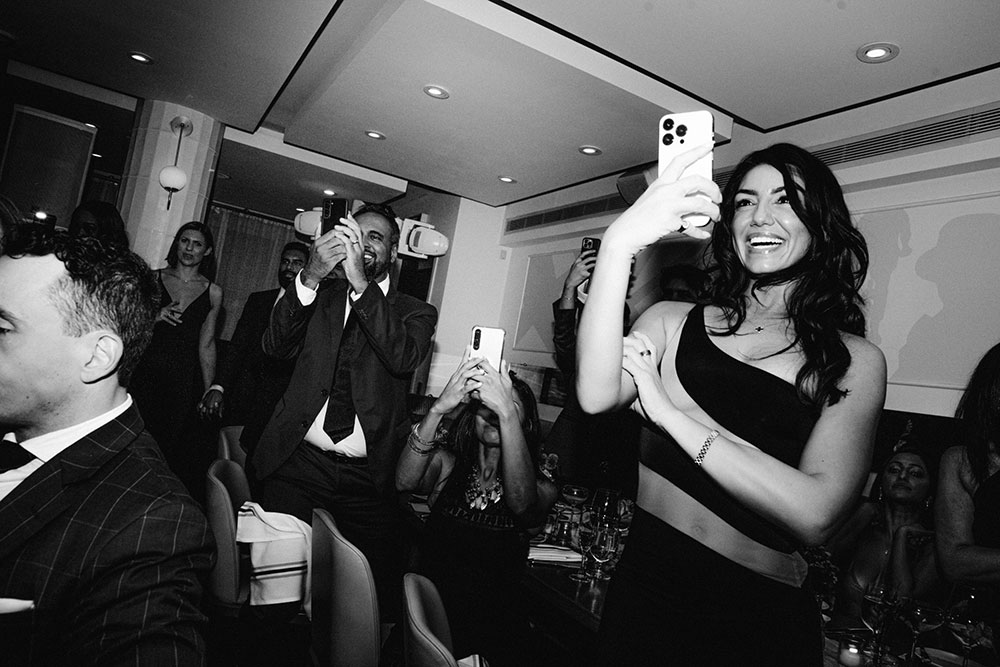 Sassafraz Yorkville Wedding Photography of the weddin guests during the wedding reception watching the lion dancers