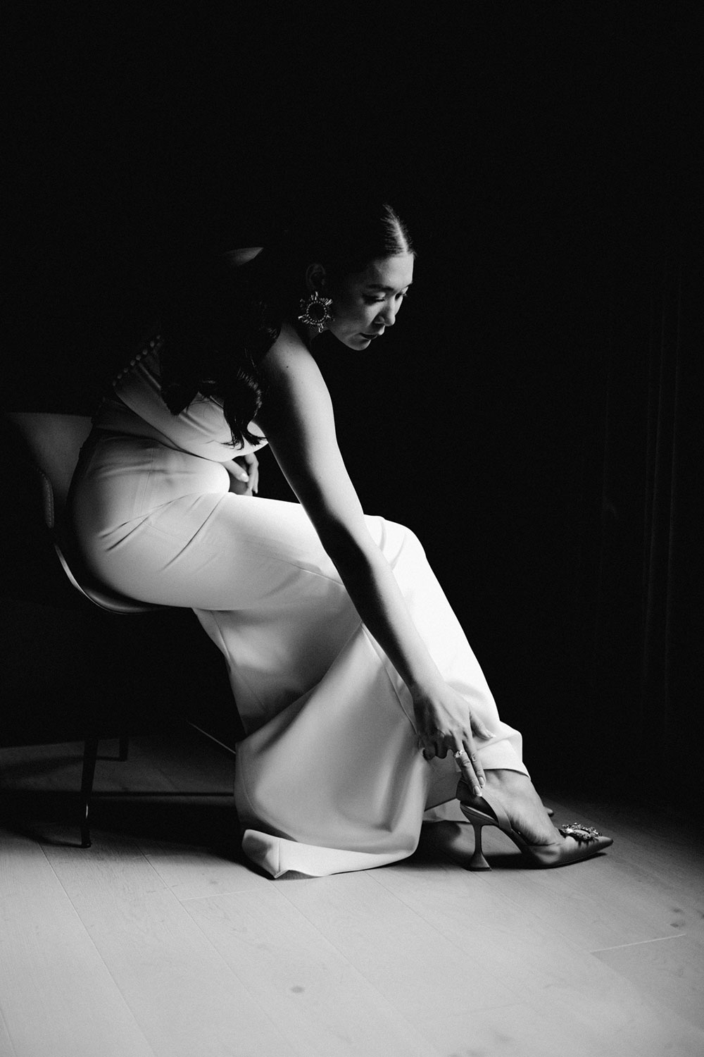 Sassafraz Yorkville Wedding Photography of the bride putting her shoe on