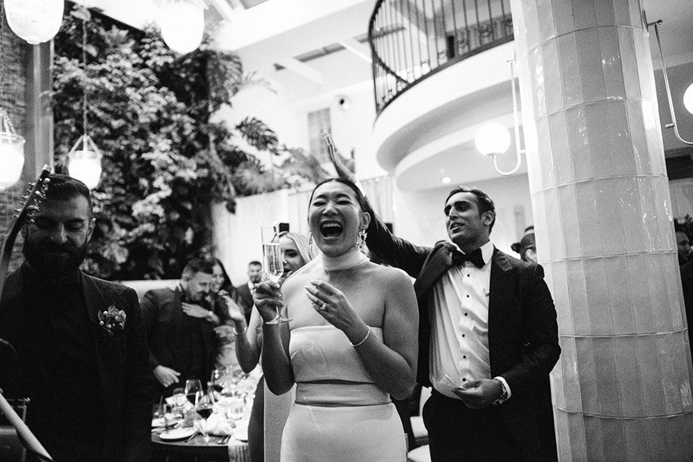 Sassafraz Yorkville Wedding Photography of the groom serenading his bride in front of all the guests during the wedding reception