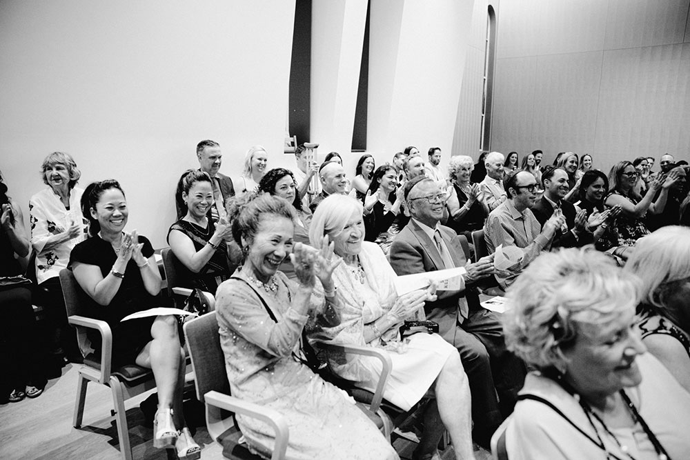 family & friends applaud the ceremony at the Holy Blossom Temple in Toronto
