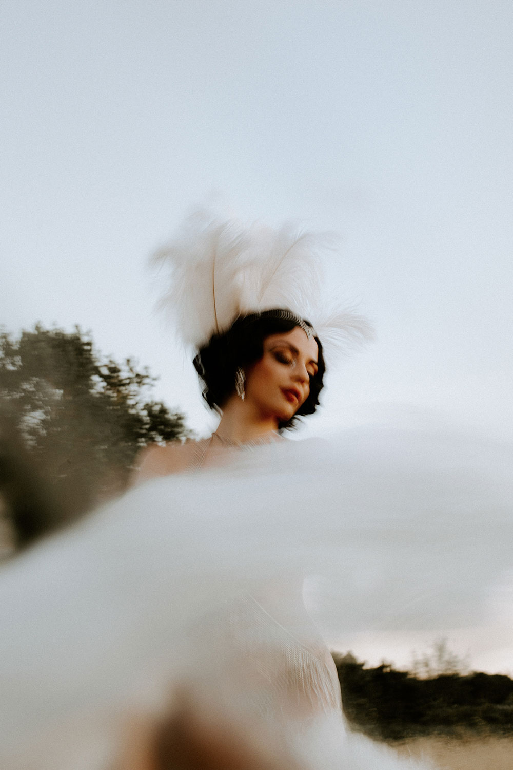 Commercial Photography of Starlotte Satine Toronto Burlesque Dancer in a field wielding large feather fans