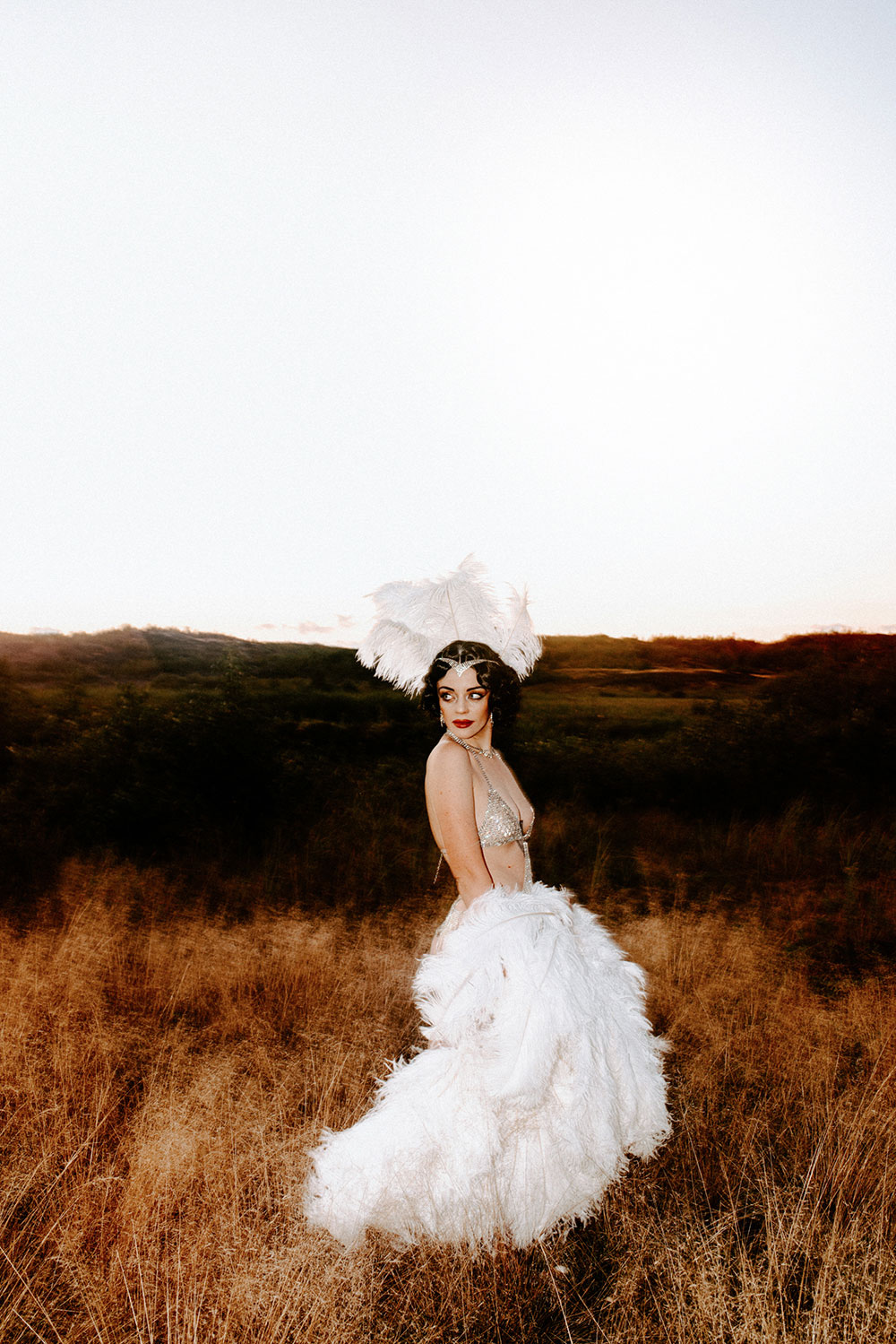 Commercial Photography of Starlotte Satine Toronto Burlesque Dancer in a field wielding large feather fans