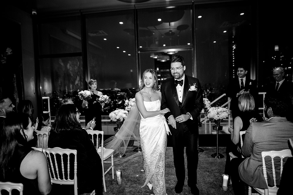 guests cheer for the newlyweds as they exit their wedding ceremony at a Antonio park wedding 