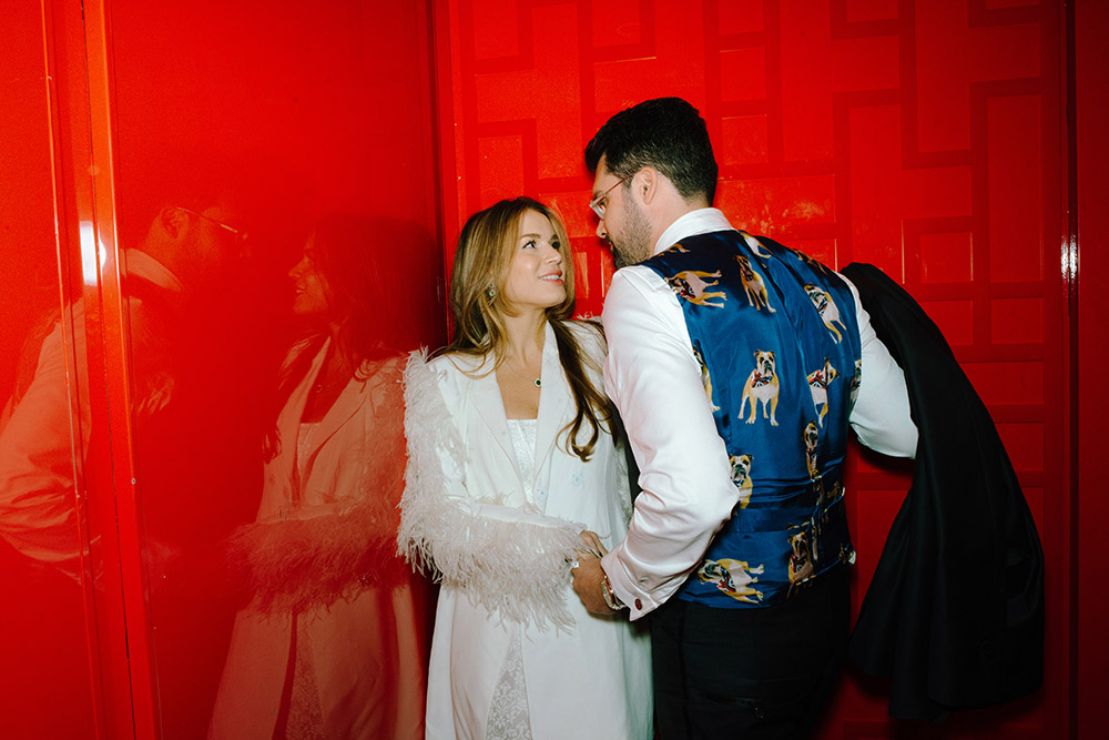 Newlsyweds pose in the red elevator at Antonio Park during their wedding