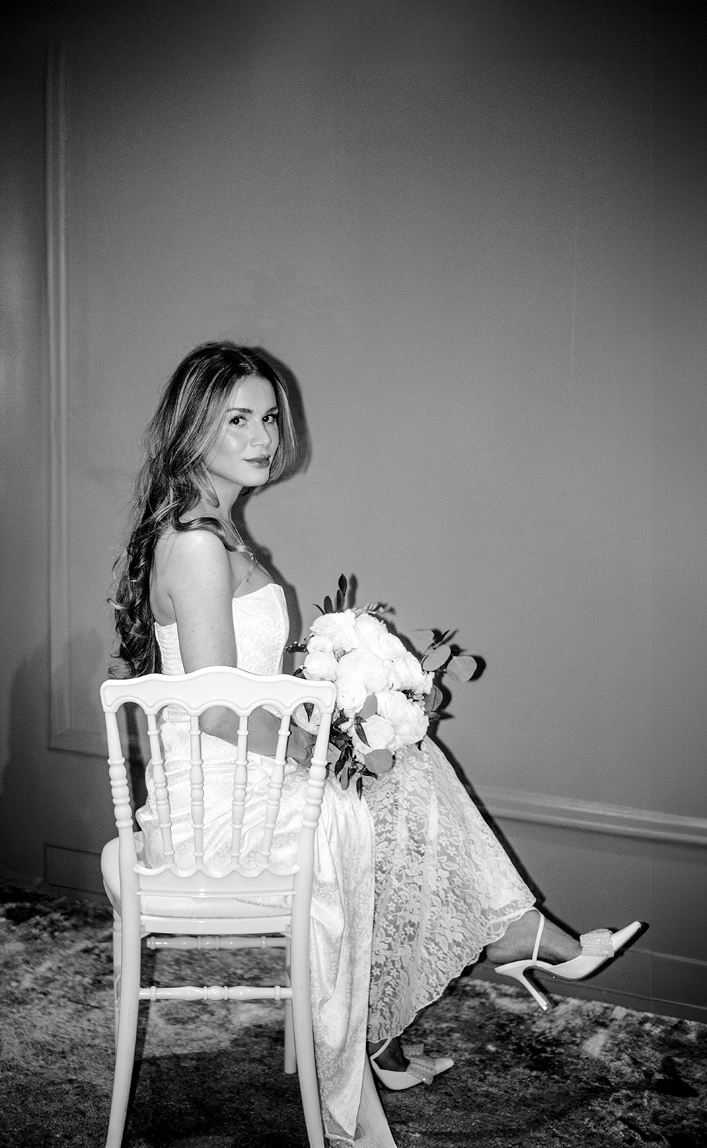 Bride poses with her bouquet by Gilded and Green Florist at her Antonio Park wedding in Toronto