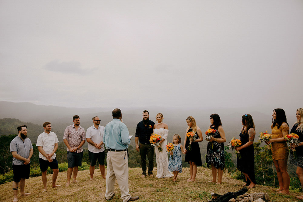 wedding party gathered at the top of a mountain in the jungle at this belize wedding