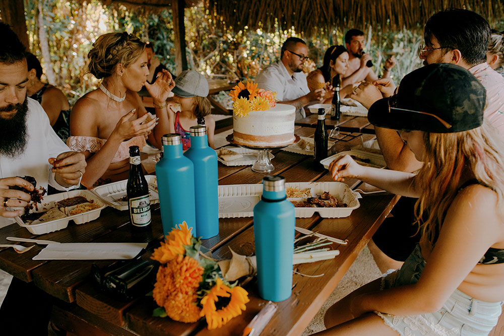 eating bbq after a big hike in the jungle at this belize wedding