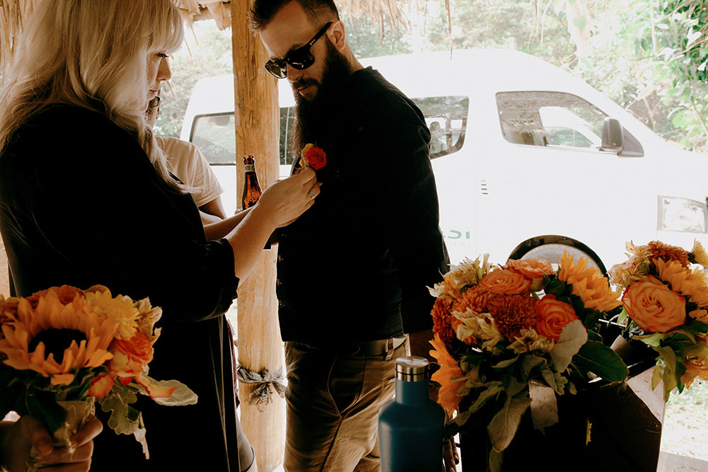 final touches before the hile uop to get married in the jungle at this belize wedding