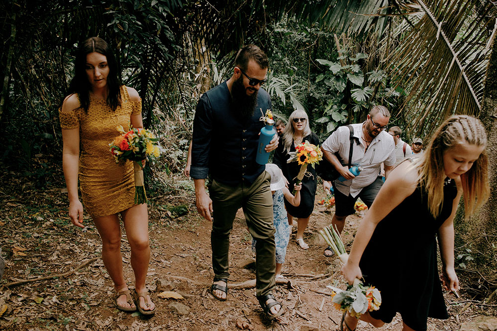 group walks up the mountain in the jungle at this belize wedding