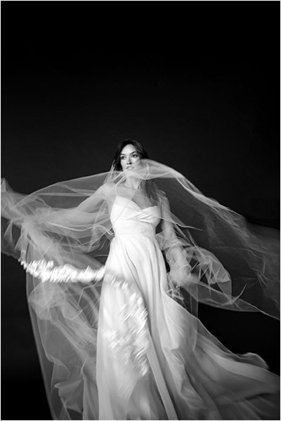 Toronto Wedding Photographer captures beautiful bride throwing her veil around in an arty way