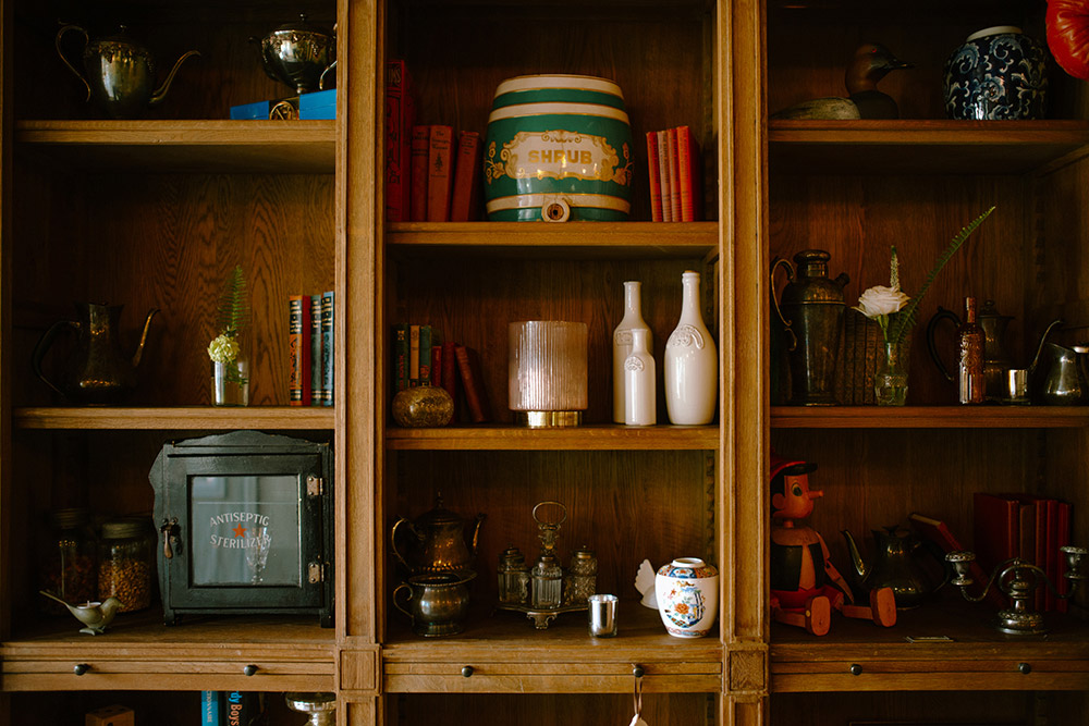 shelfs with unique antiques are part of this stunning muskoka wedding venue captured during a Northridge Inn Wedding