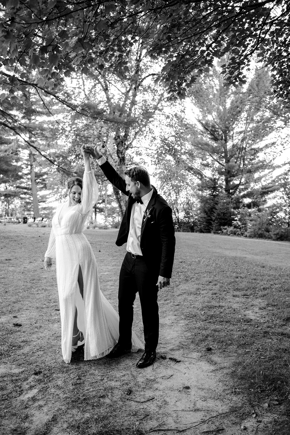 The groom twirls his bride at the Northridge Inn in Muskoka