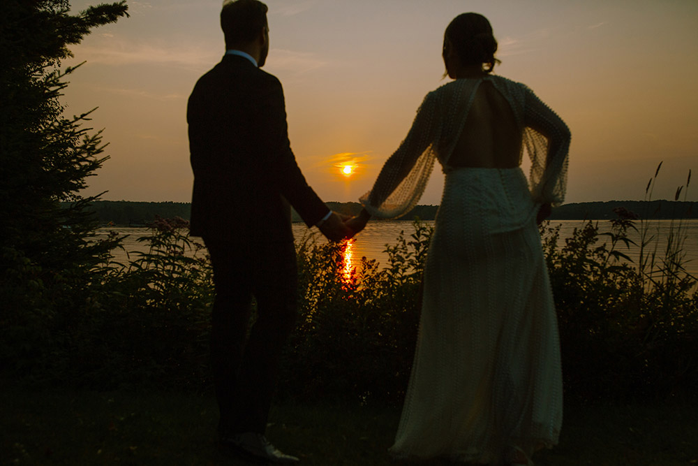 newlyweds take in the sunset at the Northridge Inn Wedding in Muskoka
