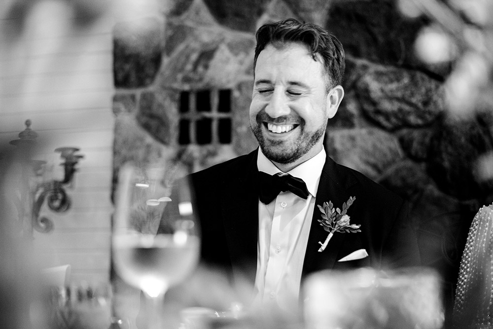 Groom enjoying a speech at his Northridge Inn Wedding