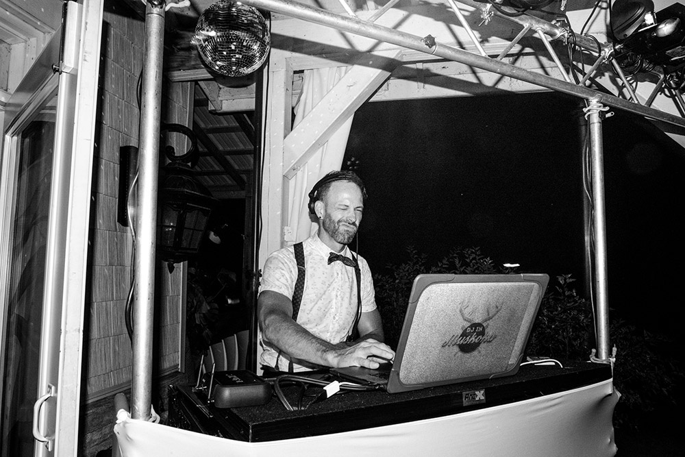 Dj in Muskoka rockin the party on the patio at this Northridge Inn Wedding