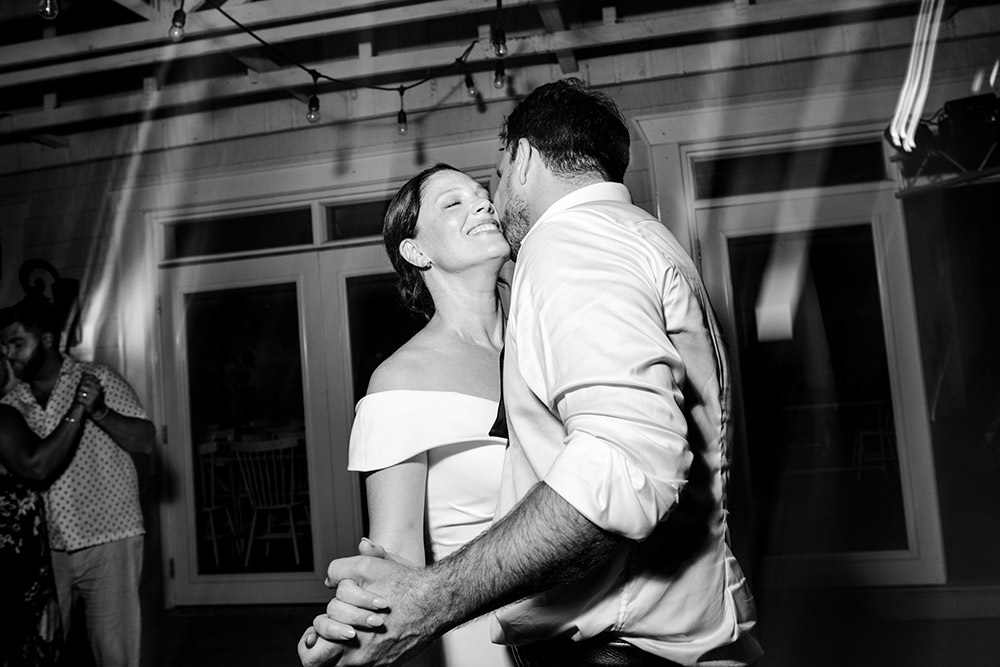 Newlyweds their first dance as husband and wife on the patio of the Northridge Inn resort under a giant canoe at the Northridge Inn in Muskoka