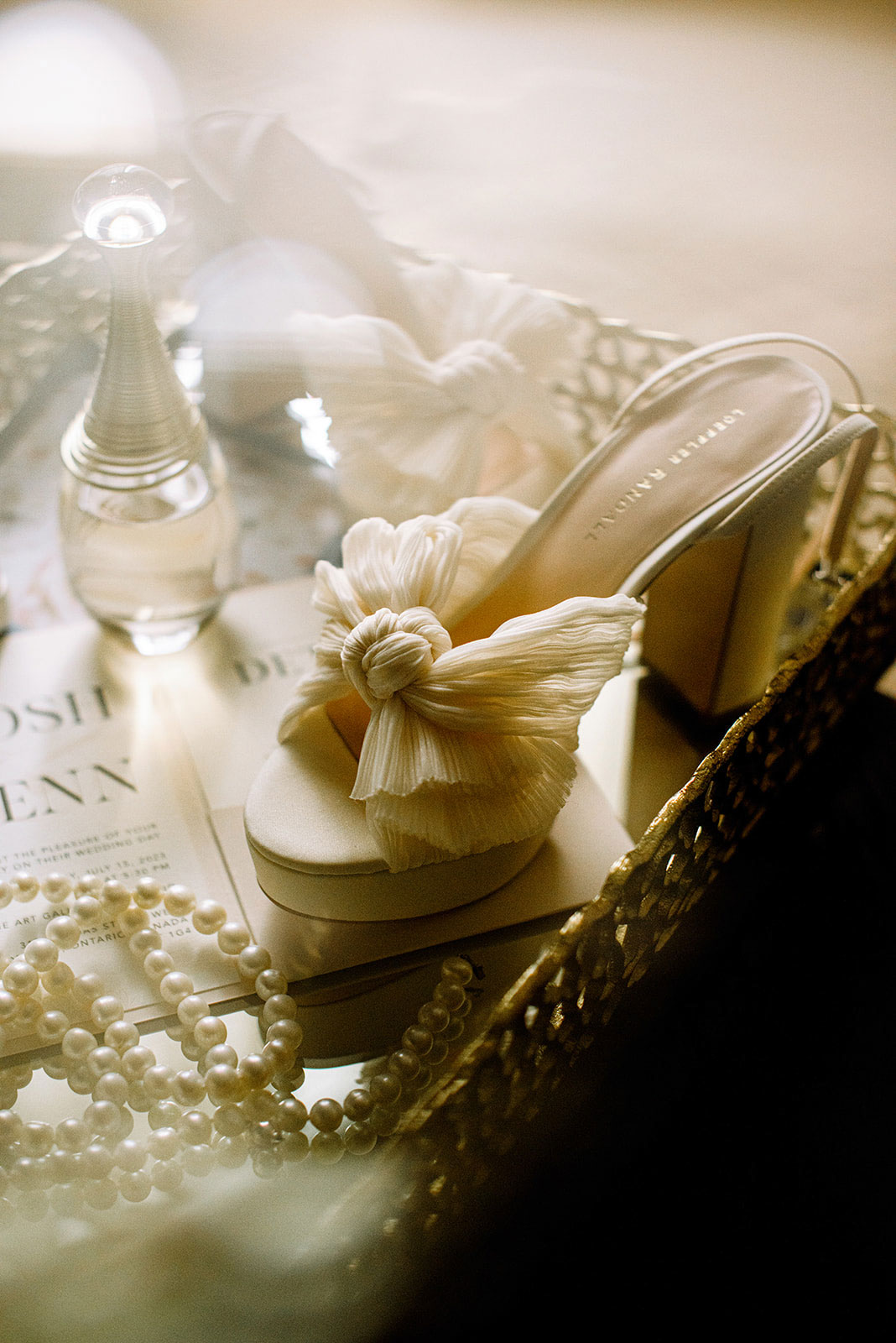 Toronto Wedding Detail Photography of very elegant shoes & perfume of the bride for this AGO wedding photography