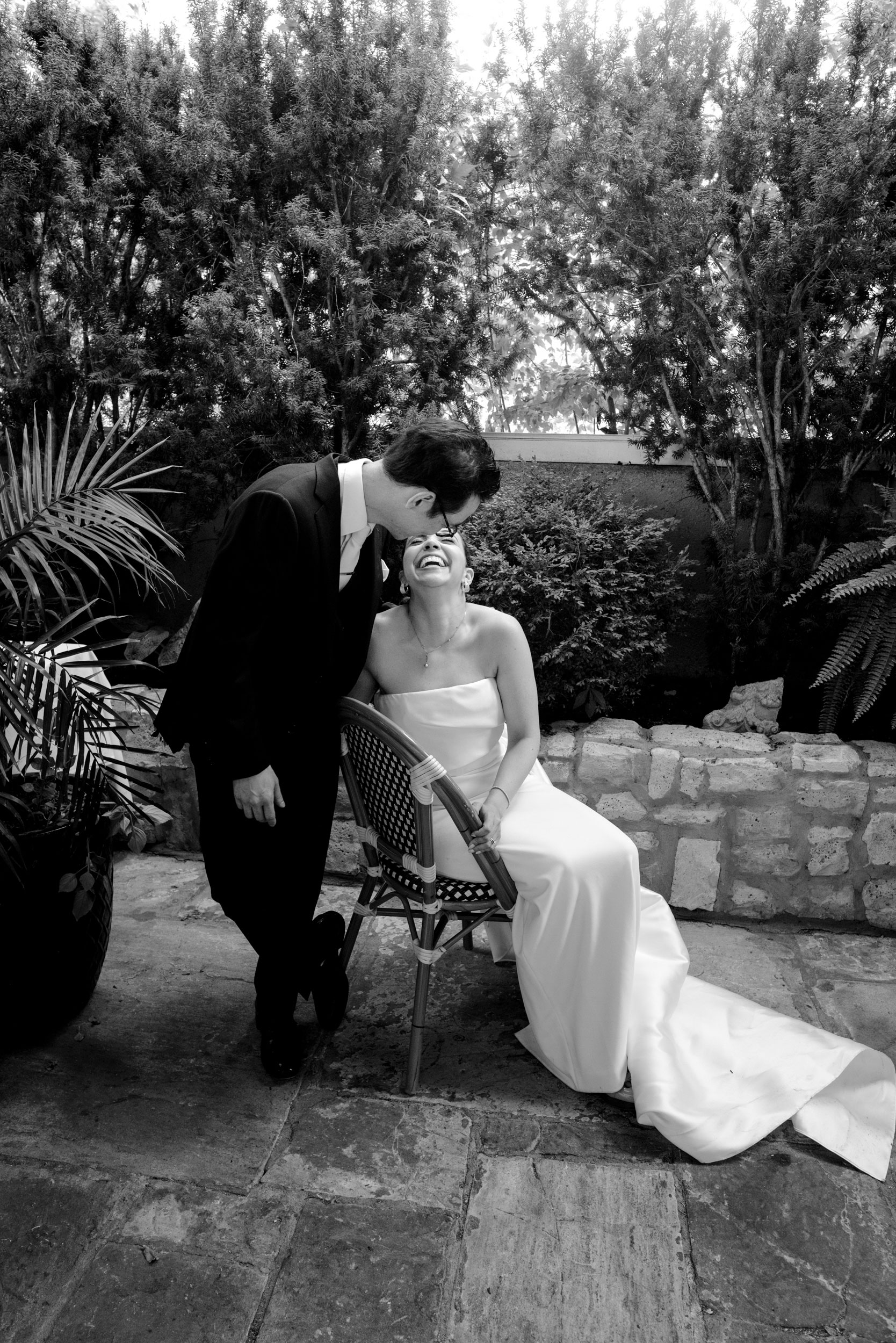 Luxury Toronto Wedding Photography of wedding couple sharing a laugh after they said their vows for all their adoring guests at the Auberge du Pommier in Toronto 