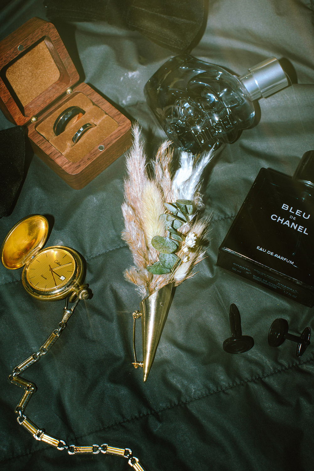 details including florals, cologne and pocket watch from a science north wedding