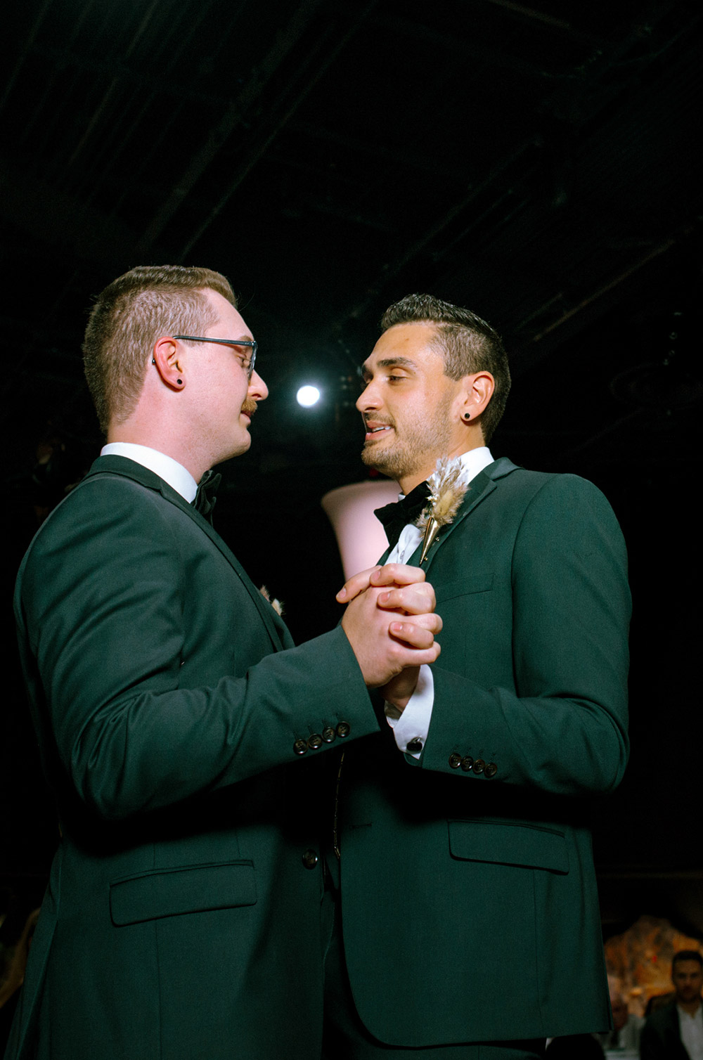 grooms enjoy their first dance at this science north wedding