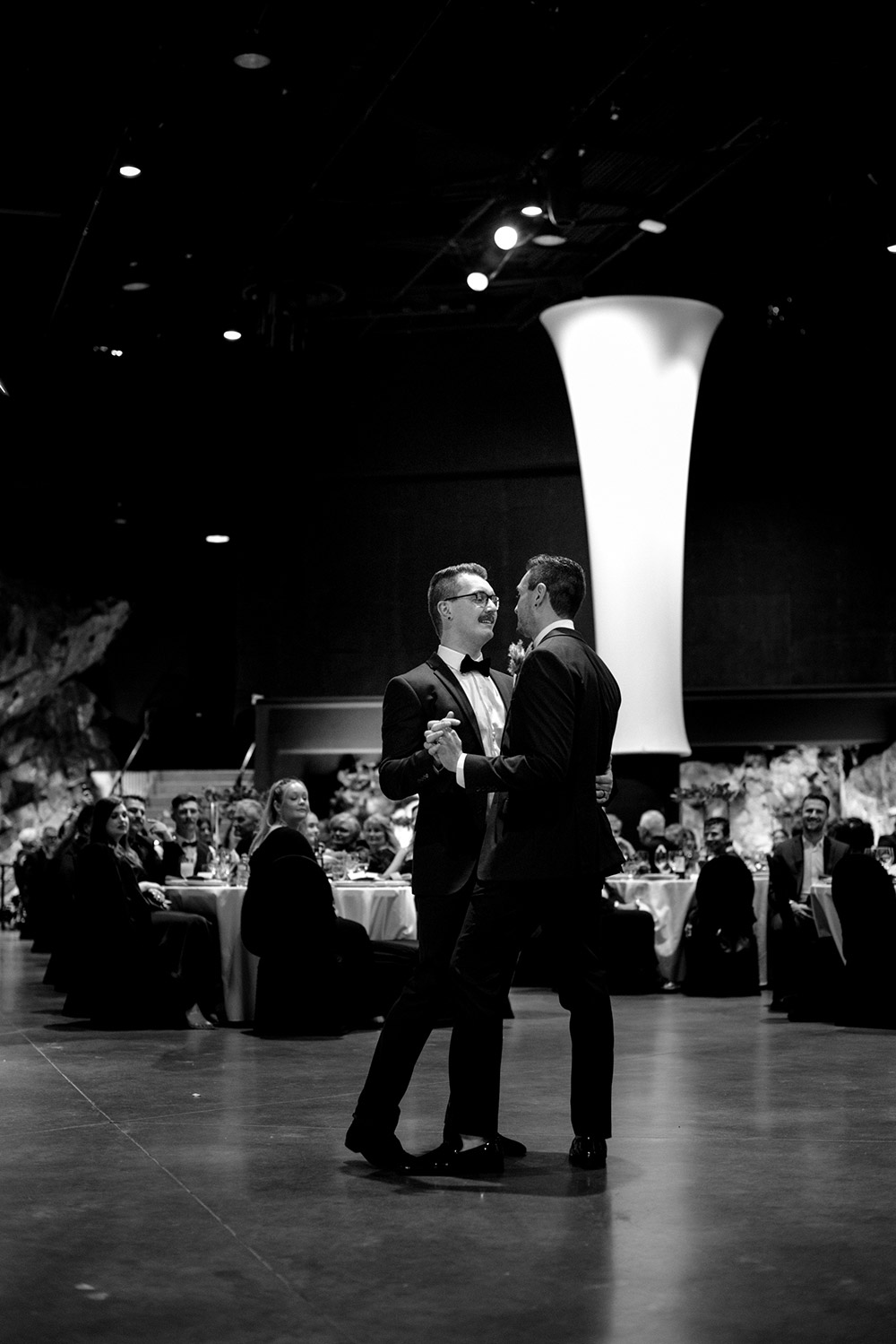 grooms enjoy their first dance at this science north wedding